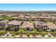 Aerial view showcasing houses in neighborhood, with a mountain range in the distance at 251 Castellari Dr, Las Vegas, NV 89138