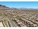 Elevated neighborhood view displaying homes, intersecting streets, and mountain vistas at 251 Castellari Dr, Las Vegas, NV 89138