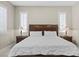 Primary bedroom features a king bed, bedside tables with lamps, and shutters on windows at 251 Castellari Dr, Las Vegas, NV 89138
