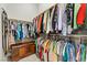 Walk-in closet with shelving and hanging racks filled with an array of clothing at 251 Castellari Dr, Las Vegas, NV 89138