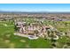 Aerial view of a vibrant community park with lush greenery, playground, and walking paths for residents to enjoy at 251 Castellari Dr, Las Vegas, NV 89138