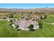 Community playground with modern play equipment, open green space, and mountain views at 251 Castellari Dr, Las Vegas, NV 89138