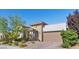 Charming single-Gathering home featuring desert landscaping and a two car garage at 251 Castellari Dr, Las Vegas, NV 89138