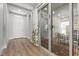 Inviting hallway featuring hardwood floors, leading to a dining area with backyard patio access at 251 Castellari Dr, Las Vegas, NV 89138