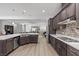 Expansive kitchen with stainless appliances, granite counters, and open access to the living space at 251 Castellari Dr, Las Vegas, NV 89138