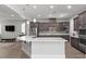 Contemporary kitchen with stainless steel appliances, a center island, and pendant lighting at 251 Castellari Dr, Las Vegas, NV 89138
