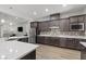 Modern kitchen featuring granite countertops, stainless steel appliances, and stylish backsplash at 251 Castellari Dr, Las Vegas, NV 89138