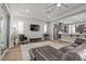 Comfortable living room with seamless kitchen access, modern furnishings, and bright lighting at 251 Castellari Dr, Las Vegas, NV 89138