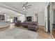 Open-concept living room adjacent to a kitchen with hardwood floors and backyard patio access at 251 Castellari Dr, Las Vegas, NV 89138