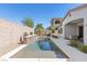 Backyard oasis featuring a narrow in-ground pool and lush landscaping perfect for outdoor entertaining at 251 Castellari Dr, Las Vegas, NV 89138