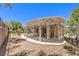 Backyard with pergola, low-maintenance landscaping, and space for outdoor seating and entertaining at 2535 Leighton Ave, Henderson, NV 89052