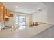 Bright dining area with sliding glass doors leading to the backyard and seamless transition to the kitchen at 2535 Leighton Ave, Henderson, NV 89052