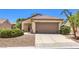 Charming single-story home featuring a neutral facade, desert landscaping, and an attached two-car garage at 2535 Leighton Ave, Henderson, NV 89052
