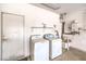 Functional laundry room equipped with washer, dryer, and essential utilities for convenient home maintenance at 2535 Leighton Ave, Henderson, NV 89052