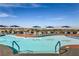 Inviting community pool with patio seating at 2535 Leighton Ave, Henderson, NV 89052