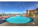 Stunning community pool with plenty of seating and umbrellas at 2535 Leighton Ave, Henderson, NV 89052
