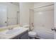 This bathroom features a shower-tub combo, single sink vanity, and a neutral color scheme at 2696 Jennydiane Dr, Las Vegas, NV 89121