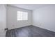 Bright bedroom featuring light gray wood floors, neutral walls, and a bright window at 2696 Jennydiane Dr, Las Vegas, NV 89121