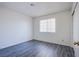 This bedroom features light gray wood floors, neutral walls, and a bright window at 2696 Jennydiane Dr, Las Vegas, NV 89121