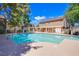 Sparkling community pool surrounded by lush greenery and inviting seating, perfect for relaxation at 2696 Jennydiane Dr, Las Vegas, NV 89121