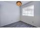 Charming dining room featuring light gray wood floors and a vintage light fixture at 2696 Jennydiane Dr, Las Vegas, NV 89121