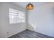 Charming dining room with light gray wood floors and a vintage light fixture at 2696 Jennydiane Dr, Las Vegas, NV 89121