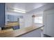 Well-lit kitchen with modern appliances, grey cabinets, and a convenient breakfast bar for casual dining at 2696 Jennydiane Dr, Las Vegas, NV 89121
