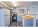 Well-lit kitchen with modern appliances, sleek gray cabinets, and light wood countertops for culinary adventures at 2696 Jennydiane Dr, Las Vegas, NV 89121