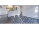 Bright open floor plan showcasing light gray wood floors and an eat-in kitchen at 2696 Jennydiane Dr, Las Vegas, NV 89121