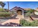 Charming condo featuring a red tile roof, stucco exterior, and landscaped front entrance at 2963 Juniper Hills Blvd # 104, Las Vegas, NV 89142