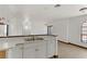 Bright kitchen boasts white cabinets and an open floor plan at 2963 Juniper Hills Blvd # 104, Las Vegas, NV 89142