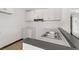 Bright kitchen features white cabinetry and stainless steel double sink at 2963 Juniper Hills Blvd # 104, Las Vegas, NV 89142