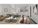 Bright, staged living room with modern decor, neutral tones, and inviting furniture arrangement at 2963 Juniper Hills Blvd # 104, Las Vegas, NV 89142