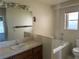 Bathroom featuring a vanity with tiled counter, a soaking tub, and neutral colors at 3090 N Woodchips Rd, Pahrump, NV 89060