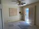 Comfortable bedroom features carpet, a ceiling fan and a sliding glass door leading to an outdoor space at 3090 N Woodchips Rd, Pahrump, NV 89060