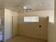Bedroom featuring carpet, a ceiling fan, closet, and a window allowing natural light to illuminate the space at 3090 N Woodchips Rd, Pahrump, NV 89060