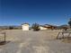 Wide view of property showing house and detached garage/workshop at 3090 N Woodchips Rd, Pahrump, NV 89060