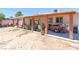 Spacious covered back patio with brick columns perfect for relaxing outdoors at 3212 Osage Ave, Las Vegas, NV 89101