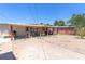 Exterior shot of a backyard with a brick path to the patio, ideal for entertaining and relaxing at 3212 Osage Ave, Las Vegas, NV 89101