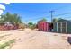 Backyard featuring two sheds with a brick path, perfect for outdoor projects and storage at 3212 Osage Ave, Las Vegas, NV 89101