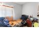 Simple bedroom featuring a single bed and a small window for natural light at 3212 Osage Ave, Las Vegas, NV 89101