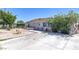 Modest single-story home features xeriscaping, mature shade tree, and spacious driveway at 3212 Osage Ave, Las Vegas, NV 89101