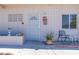 Close-up of the front entrance with security door, decorative details, and potted plant at 3212 Osage Ave, Las Vegas, NV 89101