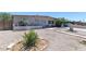 Single-story home with xeriscaping, quaint exterior details, and tidy, low maintenance front yard at 3212 Osage Ave, Las Vegas, NV 89101