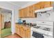 Cozy kitchen featuring wood cabinets and linoleum tile flooring at 3212 Osage Ave, Las Vegas, NV 89101