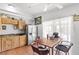 Bright kitchen with wooden cabinets, linoleum tile and eat-in area at 3212 Osage Ave, Las Vegas, NV 89101