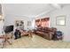 Modest living room features neutral walls and tile floor at 3212 Osage Ave, Las Vegas, NV 89101