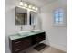 Stylish bathroom with dual sinks, modern fixtures, and a large mirror at 3310 Hillside Garden Dr, Las Vegas, NV 89135