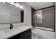 Modern bathroom featuring a black framed glass shower, matte black faucet and dark wood vanity at 3310 Hillside Garden Dr, Las Vegas, NV 89135