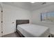 This bedroom features a neutral color palette, window with shutters and closet space at 3310 Hillside Garden Dr, Las Vegas, NV 89135